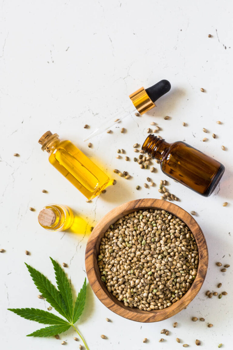 cannabis-oil-and-cannabis-seeds-at-white-JMG92QN.jpg